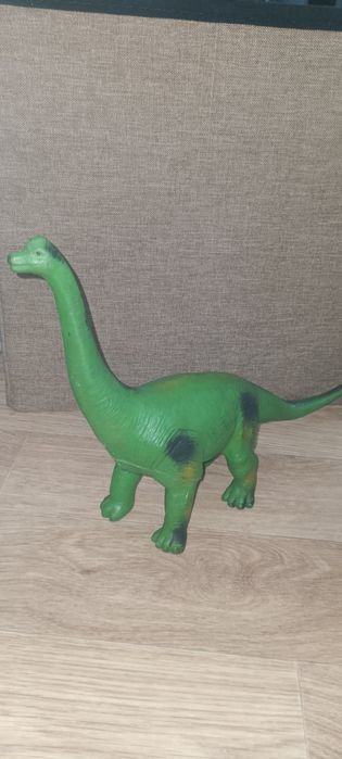Детская игрушка динозавр