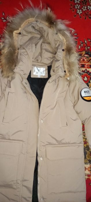 Новый  классный Пуховик