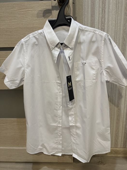 Продам новые школьные рубашки