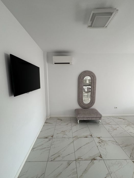 Apartament deluxe pentru inchiriere cu două camere și terasă în Giroc, modern, spațios, complet mobilat, ideal pentru confort și relaxare.