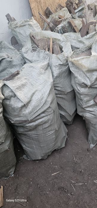 Готовые дрова в мешках