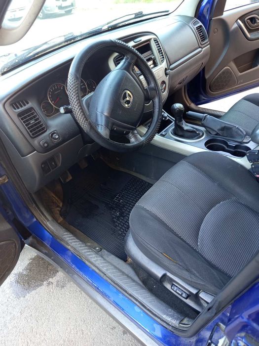 Кола Mazda Tribute