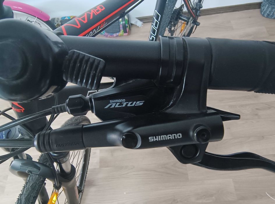 Bicicleta trekking Romet Orkan 4 M L/21 - Culori negru/rosu - Stare foarte buna