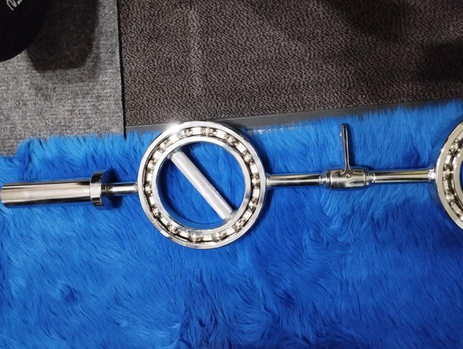 Олимпийски лост с въртящи се рингове