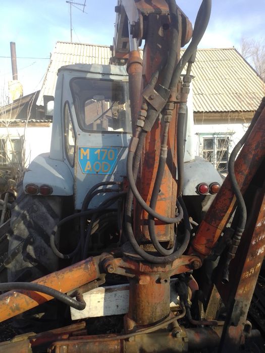 Трактор грейфер юмз