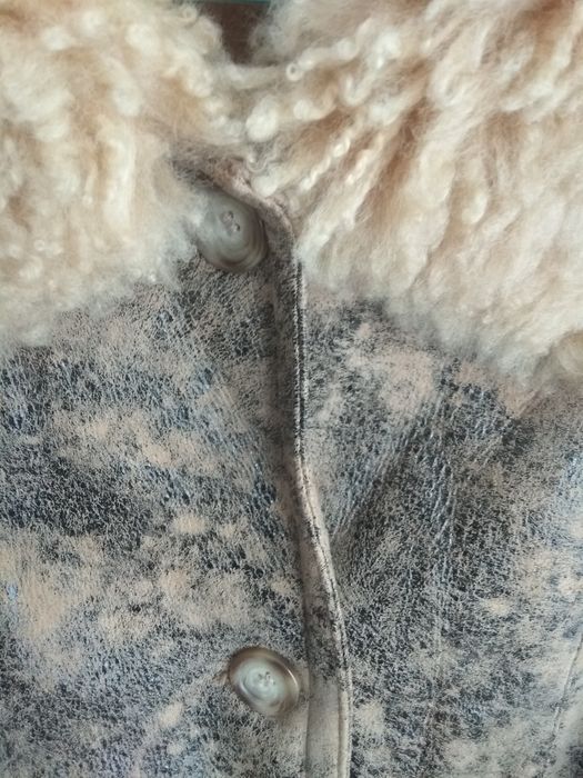 Дублёнка тёплая, тигрового цвета.