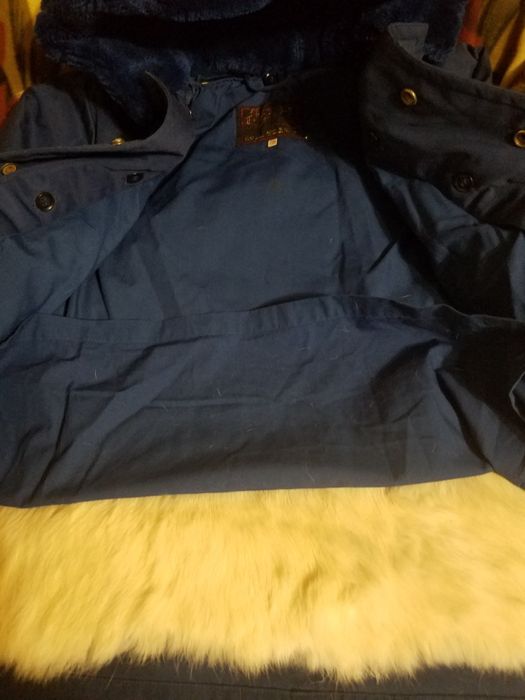 Детский плащ с отстегивающей подкладкой из натурального меха.