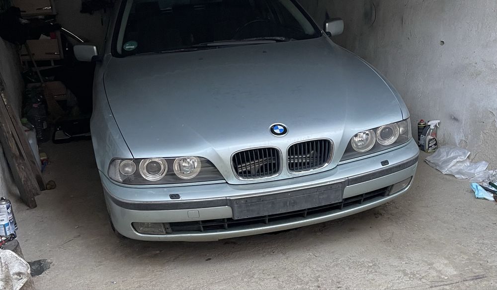 Faruri Bmw seria 5 E39 cu angel eyes (Hella)