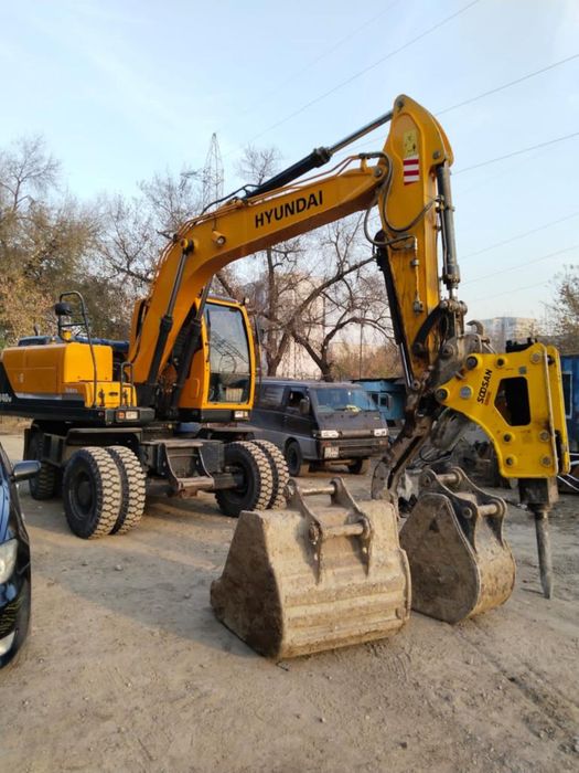 Аренда и услуги колесный экскаватор