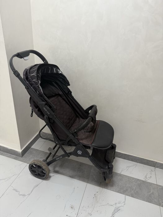 Коляска чемодан болып жиналады