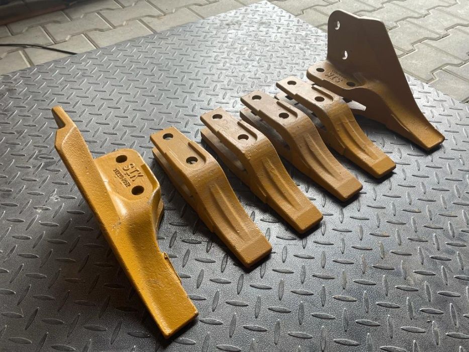 Dinte central KOMATSU WB 93, 98, 93R, 97R marca SIK