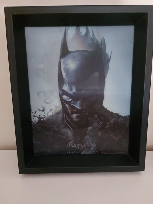 Една картина с два сменящи се  лица -на Жокера и Батман