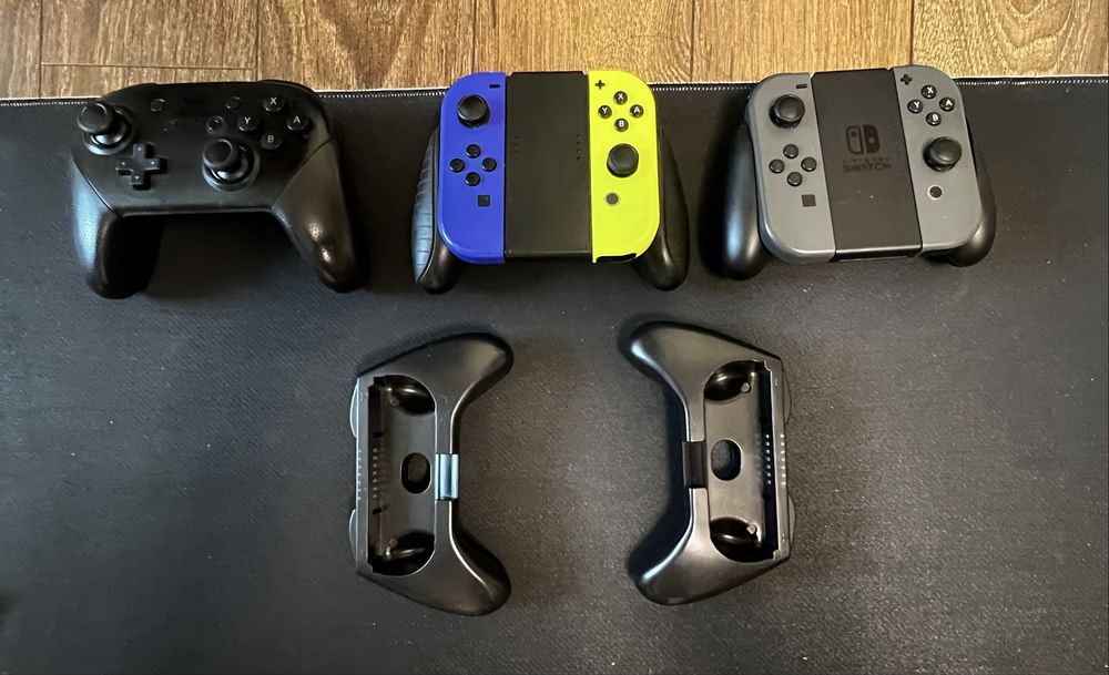 Nintendo Switch V2 (HAC-001(-01)) + 6 игри + 4 Joy-Con + Pro Controller + зарядни станции | ПЪЛЕН КОМПЛЕКТ