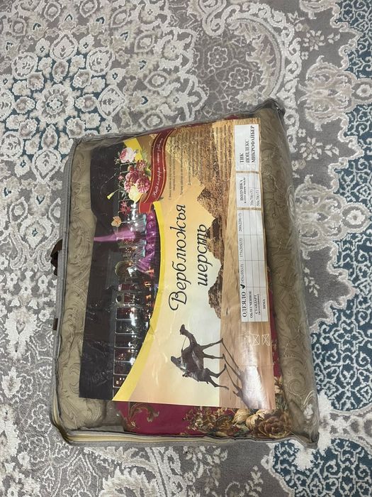 Шерстянные одеяло и пледы