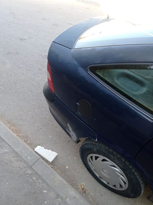 Машина Опел сатам