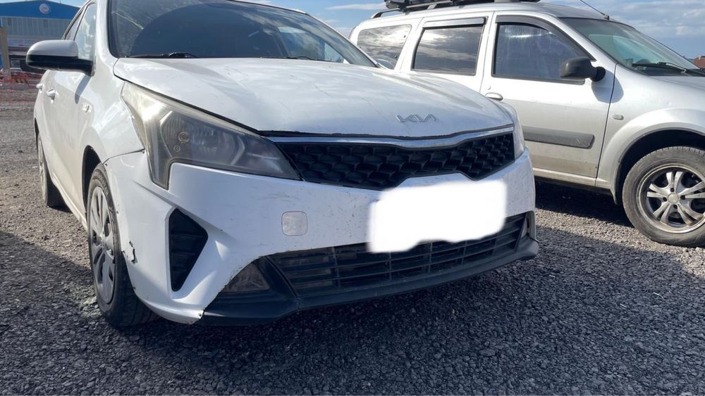 Бампер Kia Rio белый