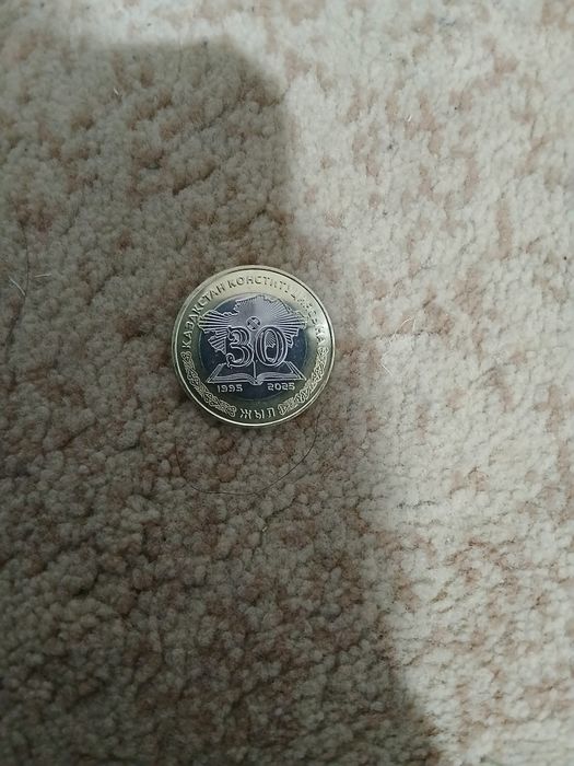 Продам монетка 100 тг 30 лет