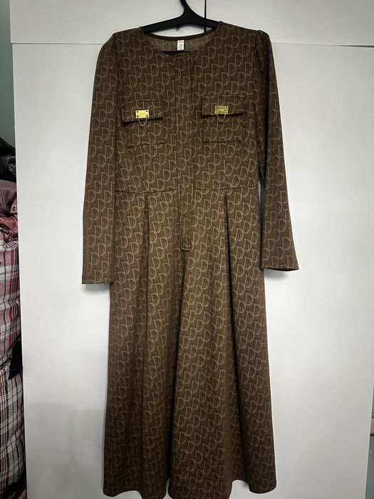 Жаңа көйлек, этикеткасымен