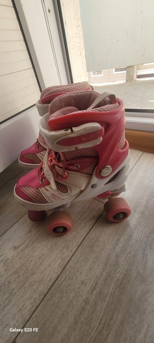 Роликовый коньки