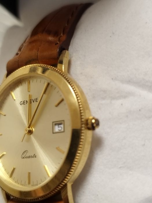 Женева золотые часы 750 пробы.