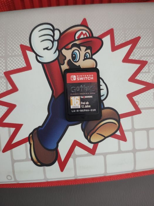 Nintendo Switch cu husa și joc