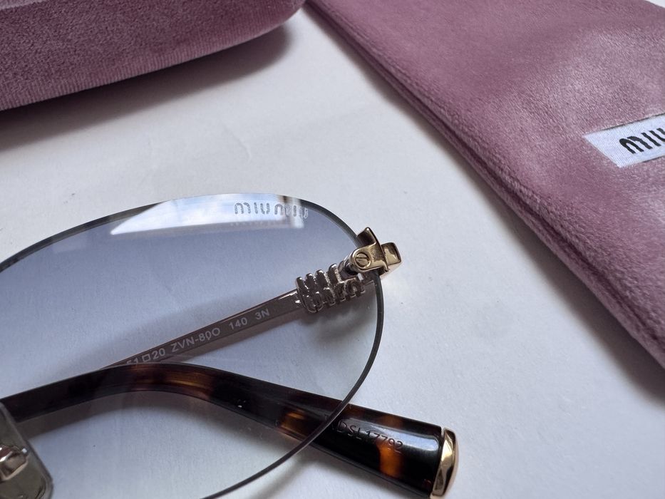 Ochelari de soare Miu Miu Oval-Rimless SMUA54 51-20 140, Noi