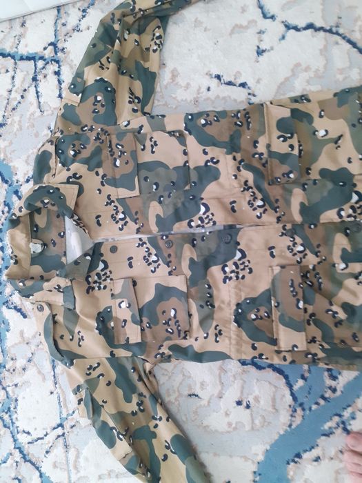 Камуфляж костюм новый.