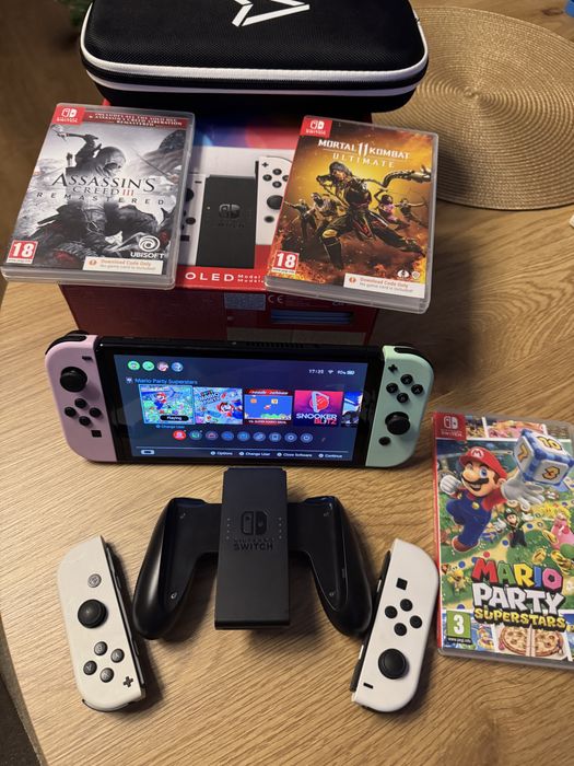 Nintendo switch oled cu 3 jocuri, husa si 4 joy-con