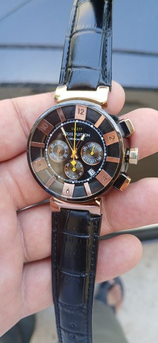 Это — модель Louis Vuitton Tambour LV‑277 Chronograph, где «LV‑277» об