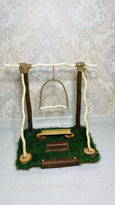Banbuk yogochidan yasalgan ruchnoy papugaylarga qonoq