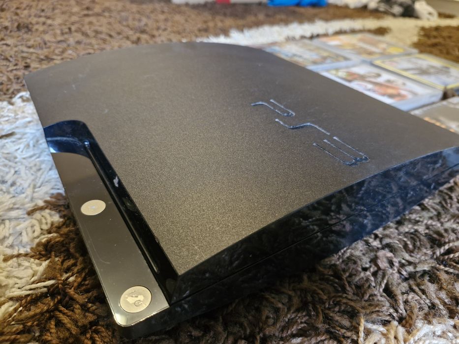 PlayStation 3  cu o maneta dual shock si cu 7 jocuri