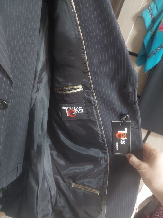 Продам новый костюм