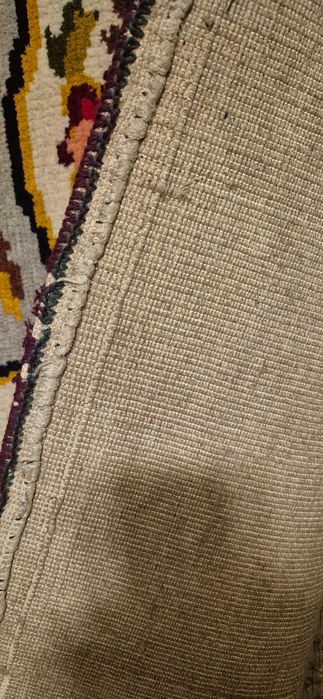 Старинный шерстяной ковёр ручной работы.