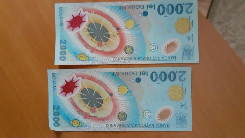Vand bancnote de 2.000 lei cu eclipsa