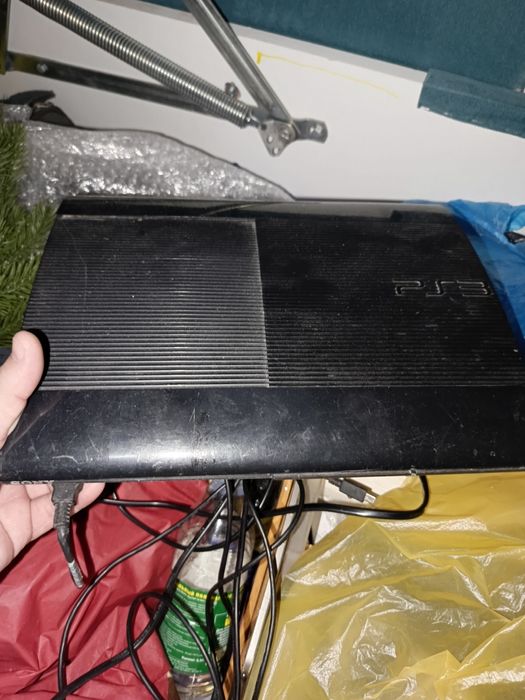 Продам PlayStation 3,руль ,и диски.