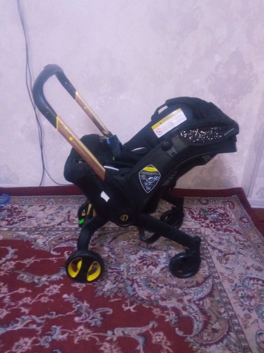 Срочно Коляска плюс автокресло Донна сотилади!