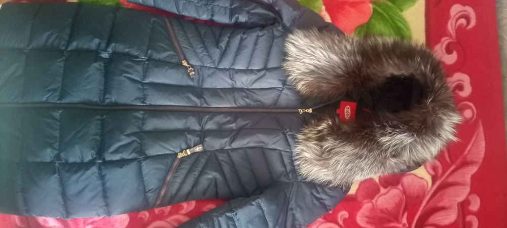 Продаю пуховик женский