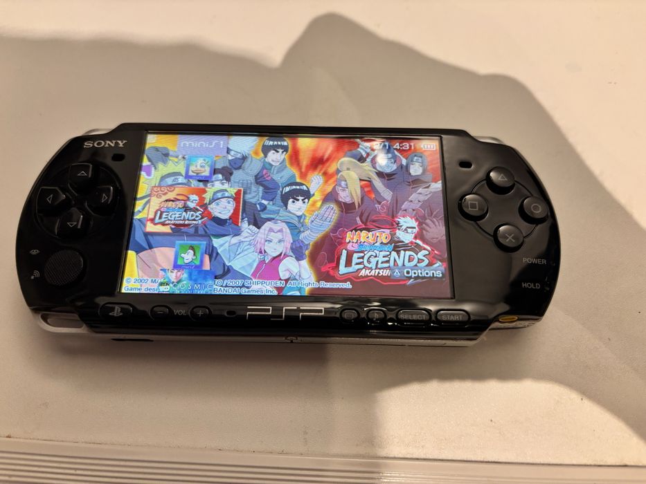 Sony Psp 3000 modat , card 64G, peste 140 de jocuri