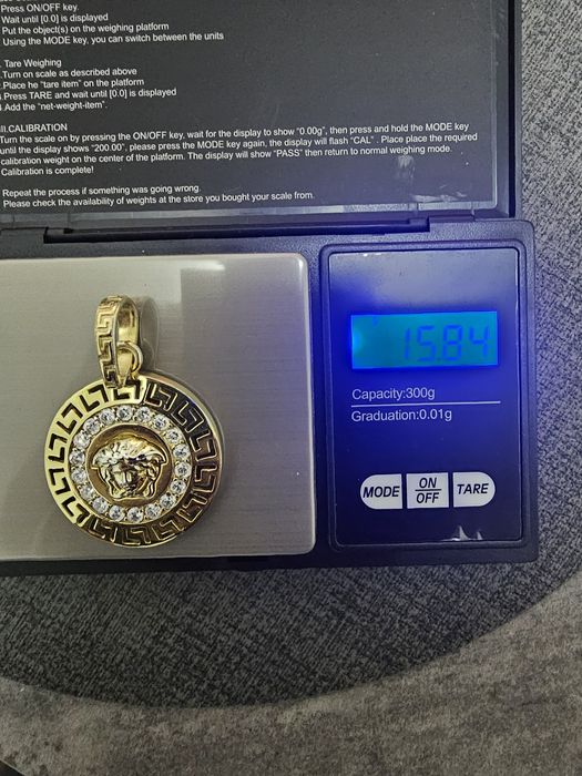 Продам кулон Versace