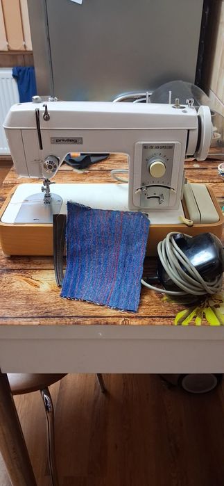 Masina de cusut privileag