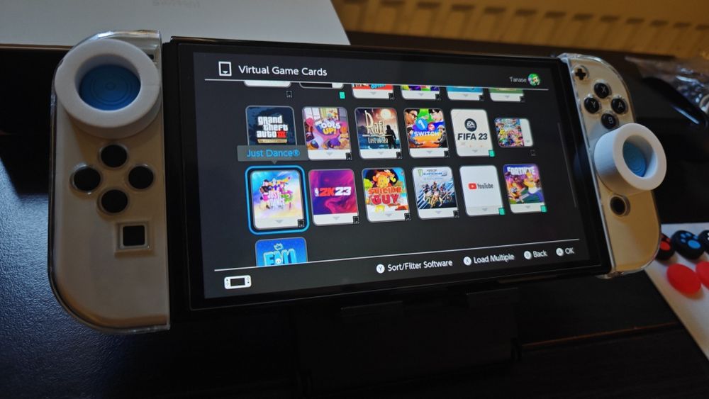 Nintendo Switch OLED (Ca Nou) + Jocuri  + accesorii