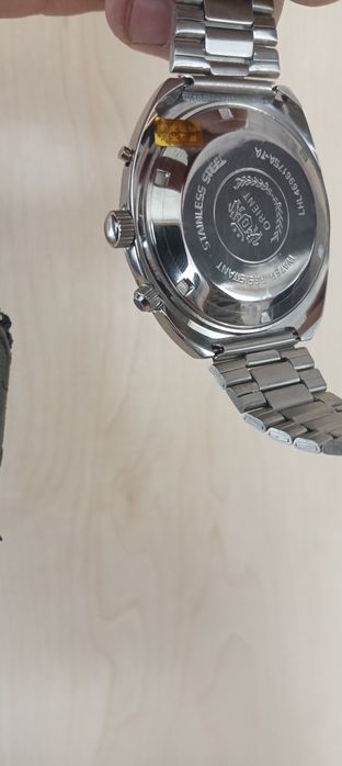 Часы Orient College.