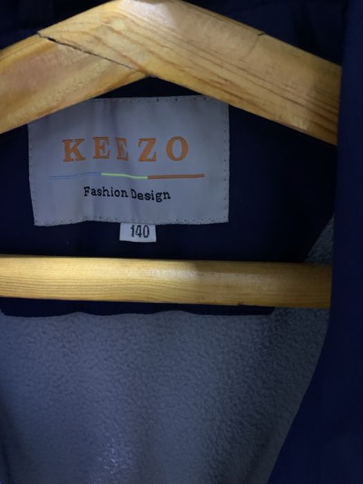 Пуховик на девочку 140 см