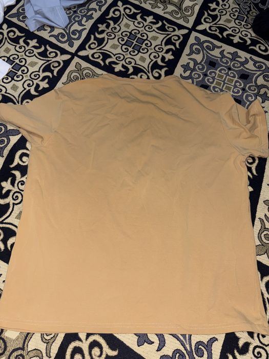 Футболка от  GLOBAL NOMADS