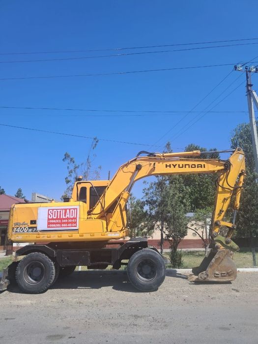 Hyundai Robex 1400W-7 g‘ildirakli ekskavatori.