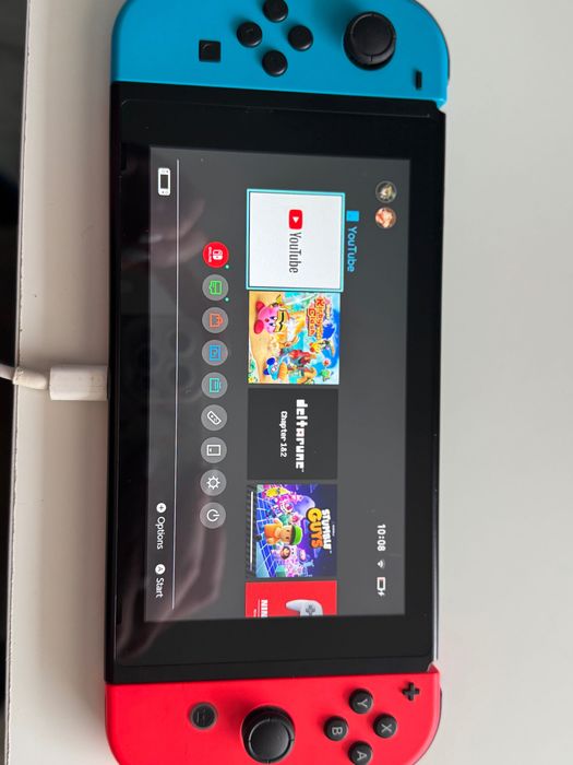 Nintendo Switch + Joy-Con (червен/син) + калъф – отлично състояние