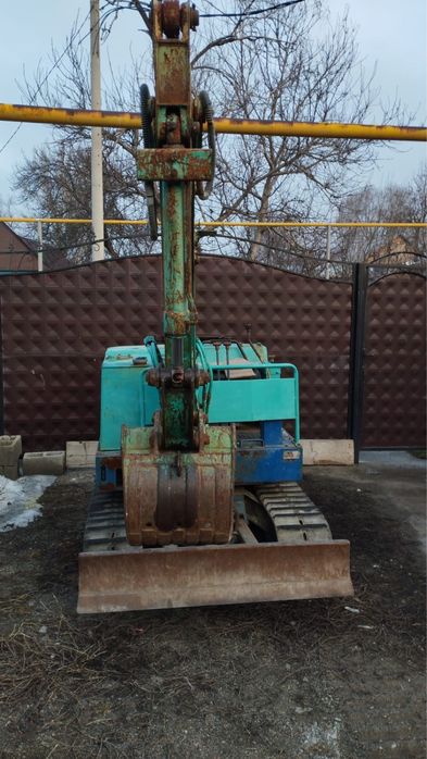 Японский миниэкскаватор Takeuchi TB