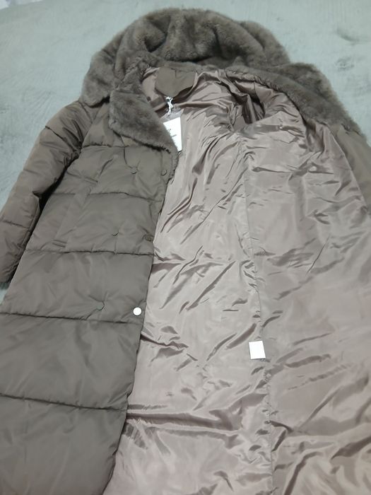 Продам пуховик новый