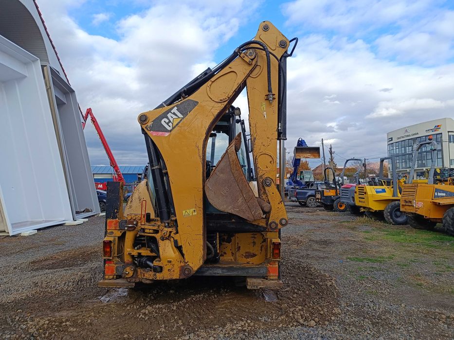 Buldoexcavator CATERPILLAR 428E , cupa multifunctionala