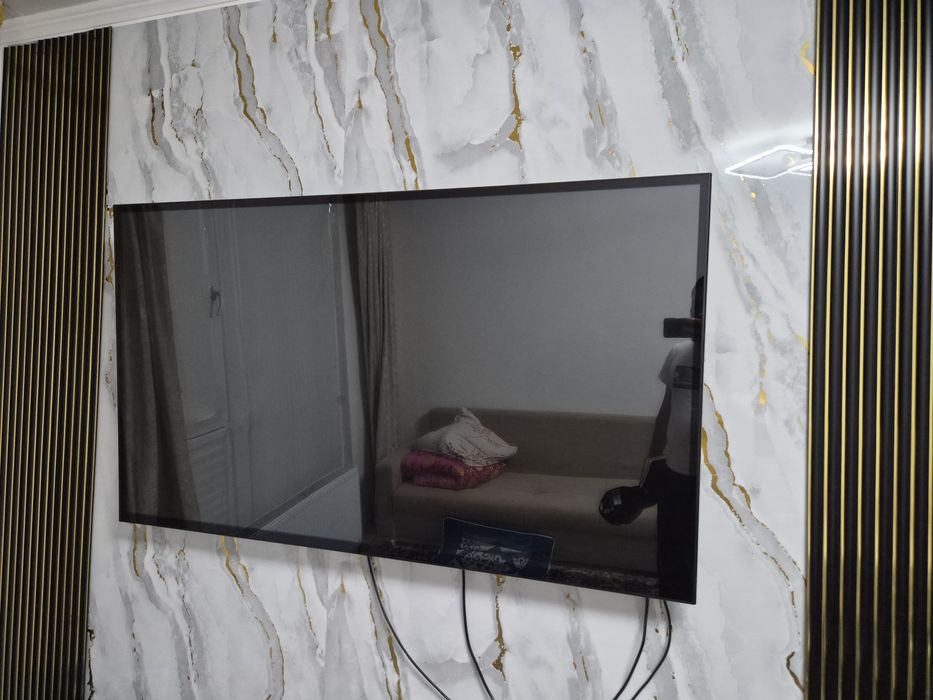 Китайский телевизор с размером 145×85